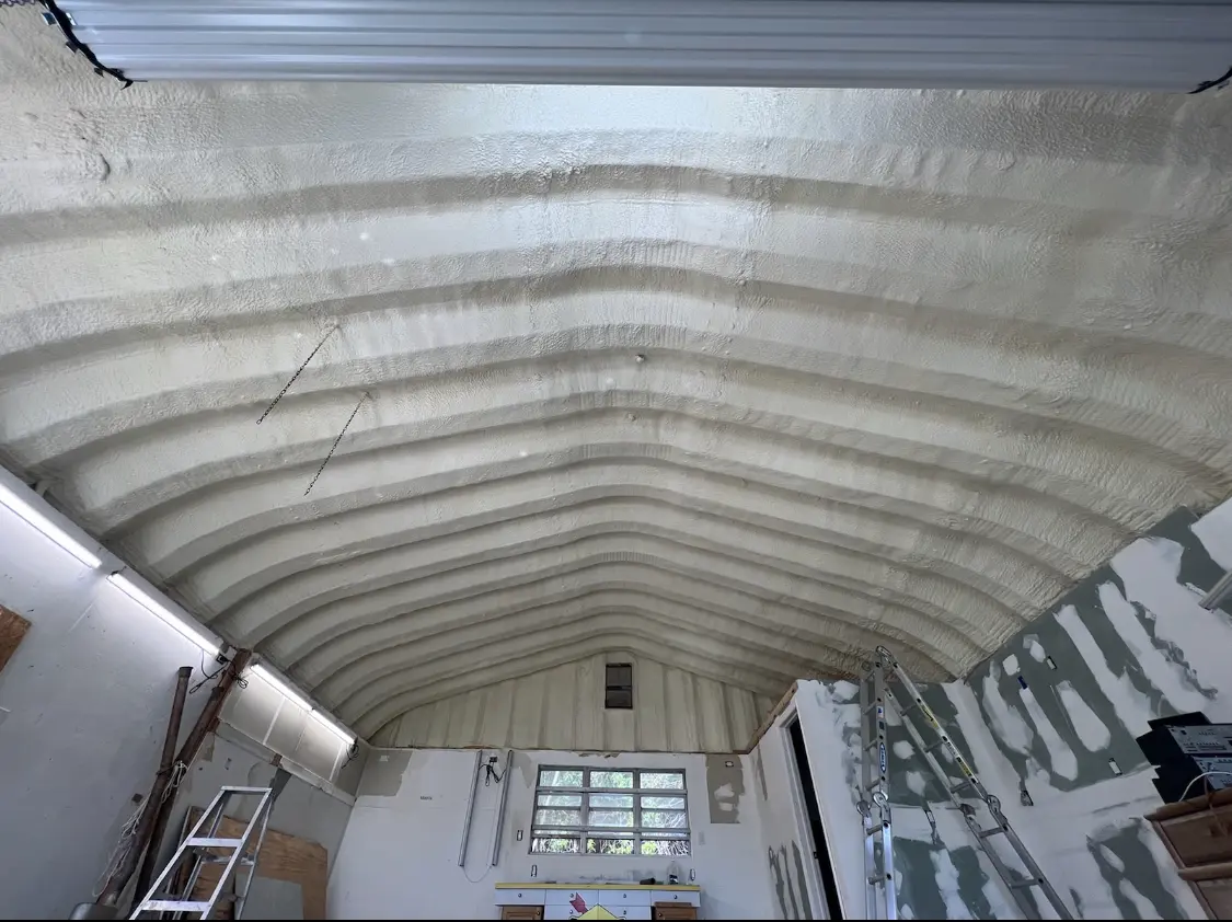 Spray polyurethane foam applied to the underside of a metal roof deck in North Fayette